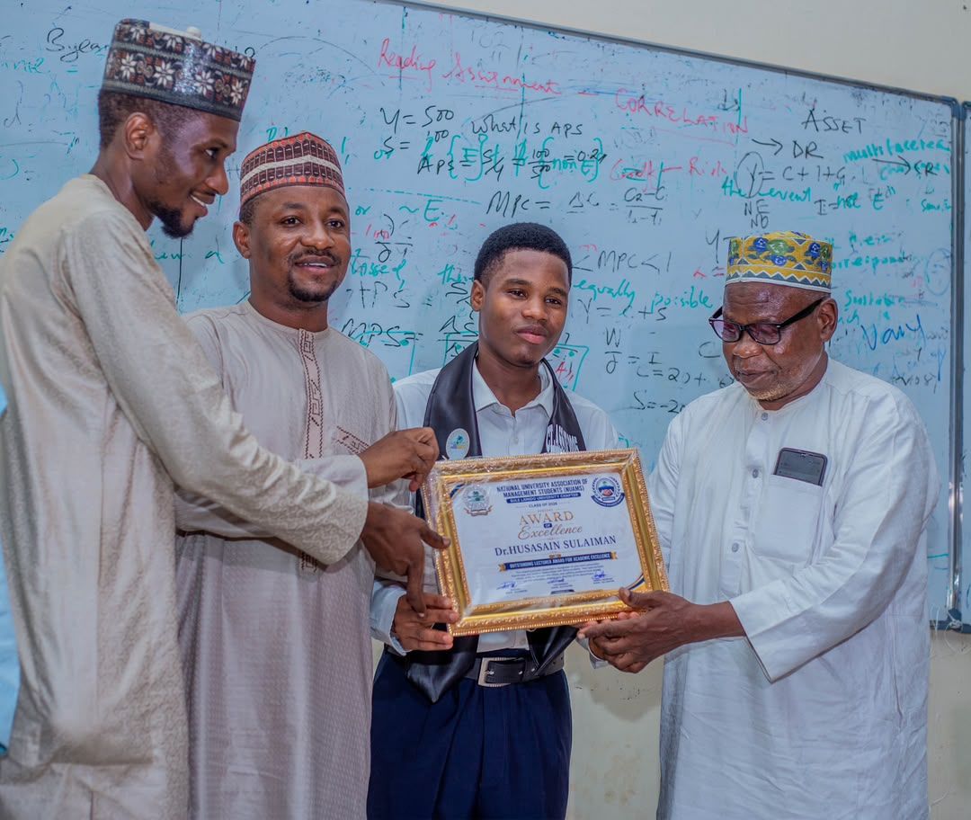 Presenting a certificate of recognition at the Faculty