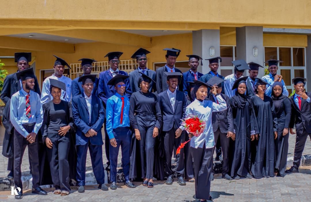 Graduating students pose for a photo after convocation
