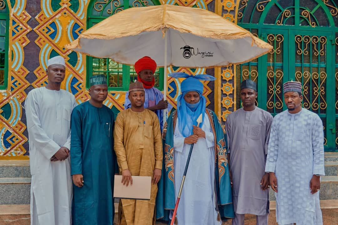 Faculty staff and traditional title holders at a Faculty event